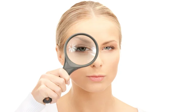 Woman with magnifying glass — Stock Photo, Image