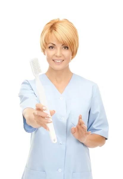 有吸引力的女医生用牙刷的图片 — 图库照片