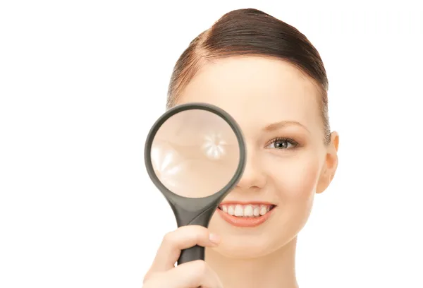 Woman with magnifying glass Stock Picture