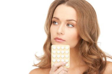 Picture of young beautiful woman with pills clipart