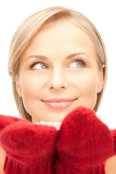 Beautiful woman in red mittens with snow — Stock Photo, Image