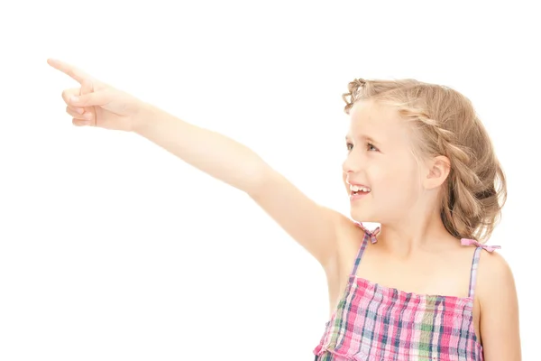 Маленька дівчинка вказує пальцем — стокове фото