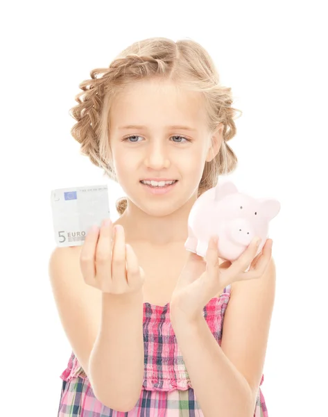 Holčička s prasátko a peníze — Stock fotografie