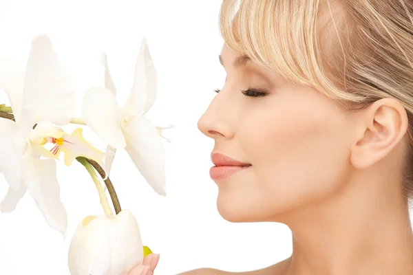 Beautiful woman with orchid flower — Stock Photo, Image