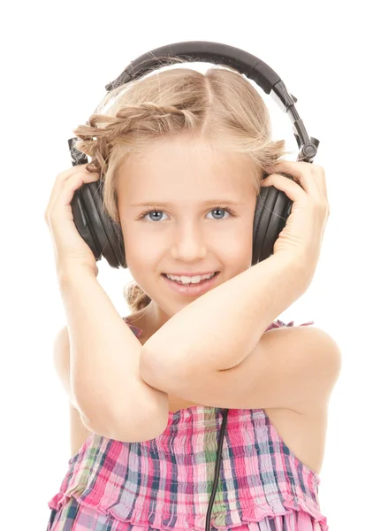 Happy girl in big headphones Stock Photo
