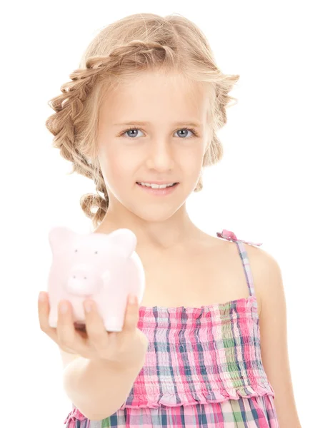 Menina com banco porquinho — Fotografia de Stock