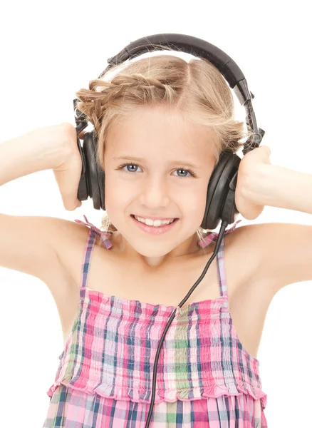 Szczęśliwa dziewczyna w duże słuchawki — Zdjęcie stockowe