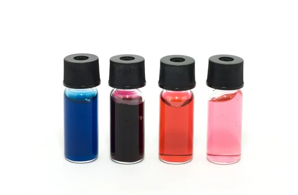 Lahvičky s barevnou tekutinou — Stock fotografie