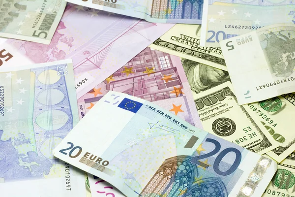 Банкноты в долларах и евро Стоковая Картинка