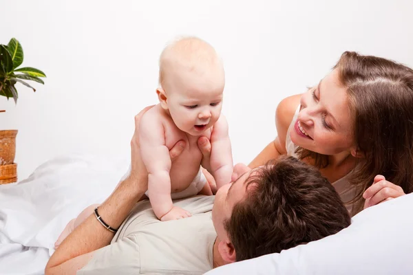 Lovely family in bed — Stock Photo, Image