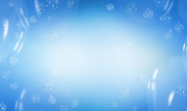 ハート形の石鹸の泡青い背景上 — ストック写真