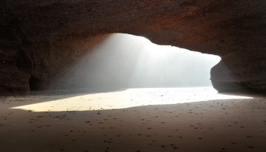 Under arch rock formation in Morocco clipart