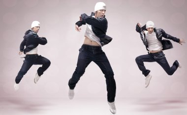 Abstract studio photo of three hip hop dancers clipart