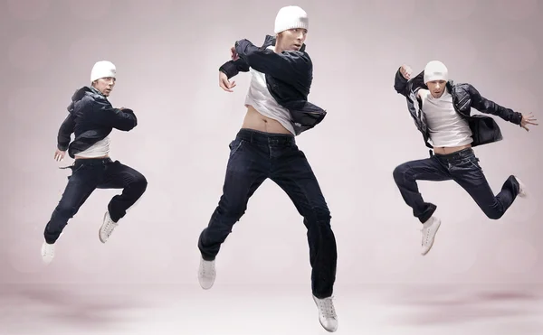 Abstrakt studio foto av tre dansare hip hop — Stockfoto