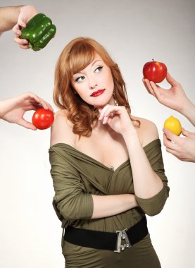 Beautiful woman making a vegetable choice clipart
