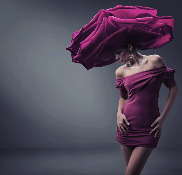 Young beauty wearing roses hat