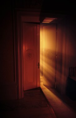 Heavenly rays of light behind the door clipart