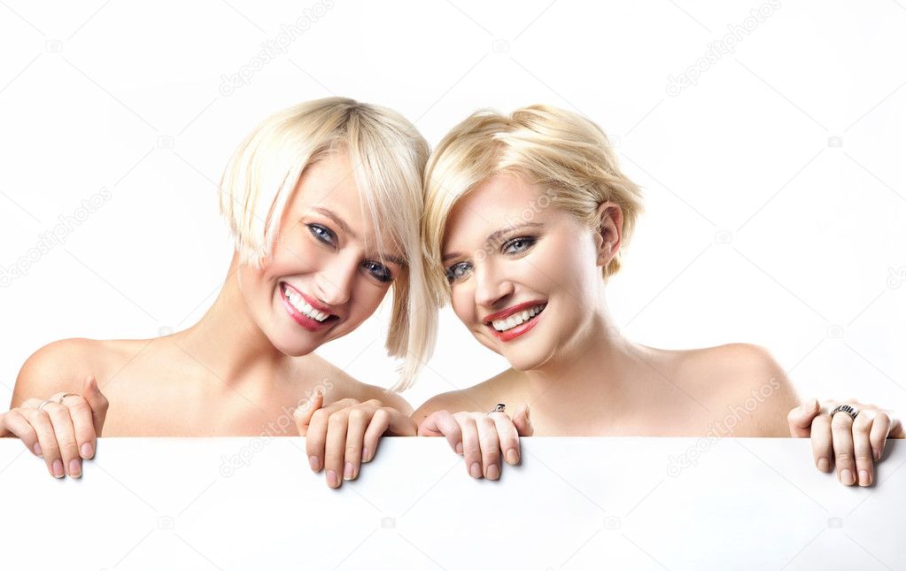 Young girls smiling on the white background