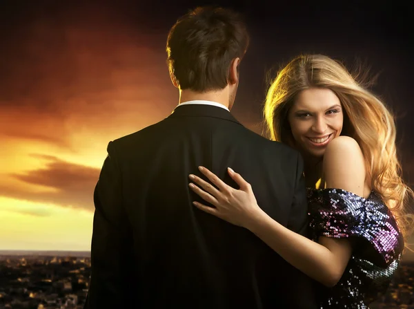 Conceptual portrait of a young couple in elegant evening dresses Royalty Free Stock Images