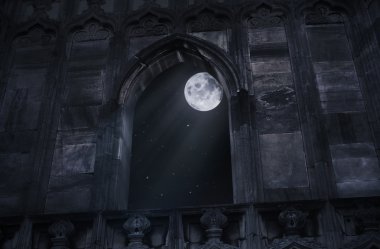 Full moon seen through the window of the old castle clipart