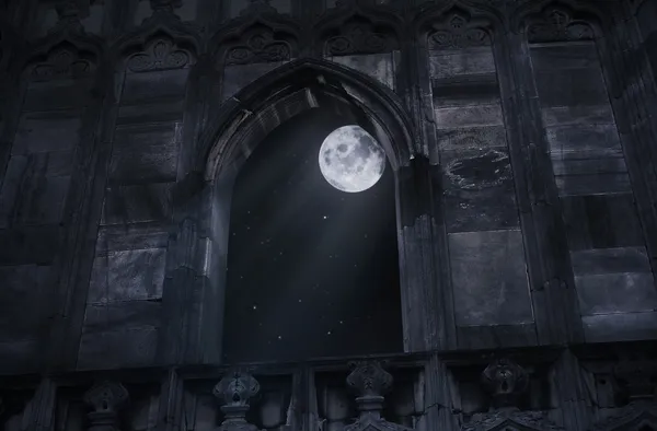 Full moon seen through the window of the old castle — Stock Photo, Image