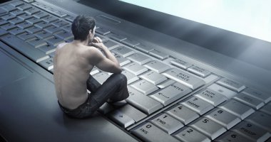 Conceptual photo of a young man addicted to the internet clipart