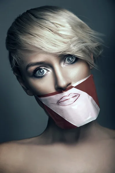 Conceptual photo of woman with the mouth taped up — Stock Photo, Image