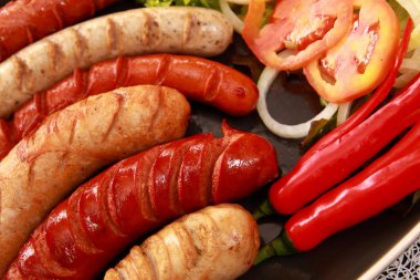 Sausage and vegetables. clipart