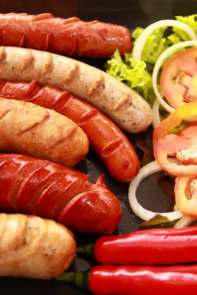 stock image Sausage and vegetables.