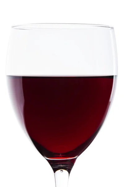 Un bicchiere di vino rosso sul bianco. Dettaglio — Foto Stock