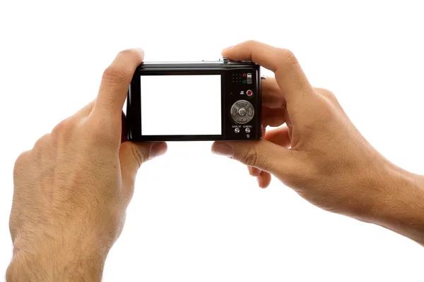 Φωτογραφία κάμερα στα χέρια που απομονώνονται σε λευκό φόντο — Φωτογραφία Αρχείου
