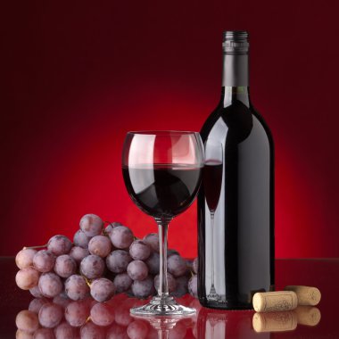 Bottle and glass of red wine clipart