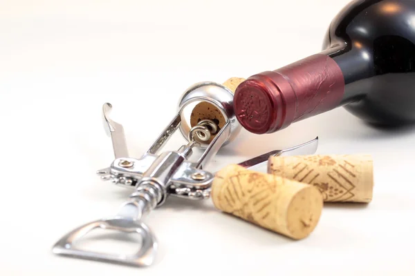 Corks, red wine and corkscrew — Stock Photo, Image