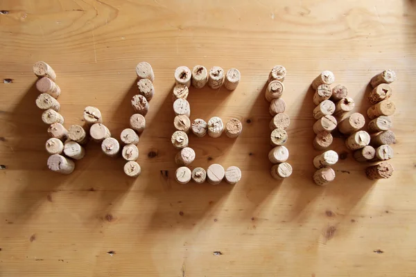 Corks forming the word wine — Stock Photo, Image