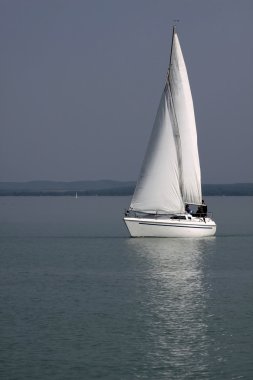 White sailboat on Lake Balaton clipart