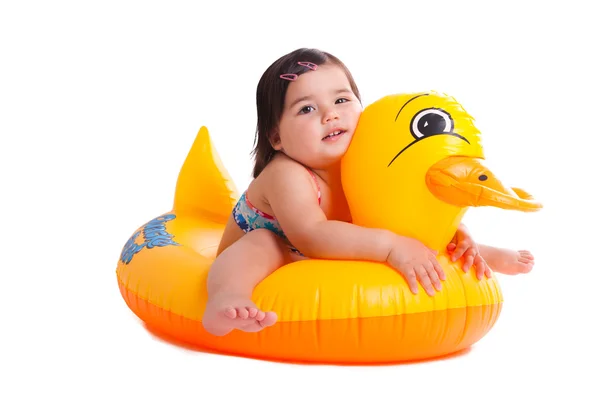 Adorable child sitting on a duck — Stock Photo, Image