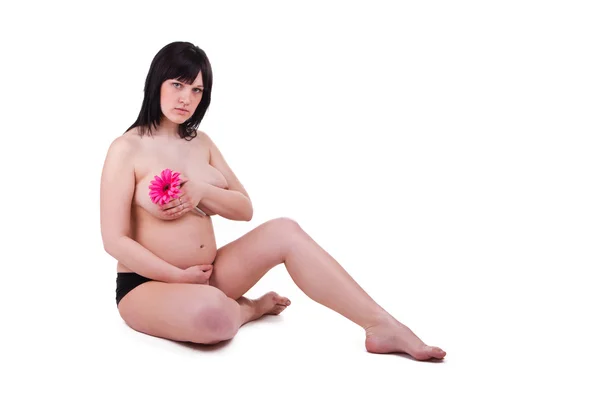 Jovem grávida com uma flor — Fotografia de Stock