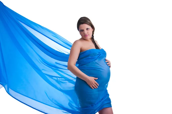 stock image Pregnant woman in fabric holding her belly