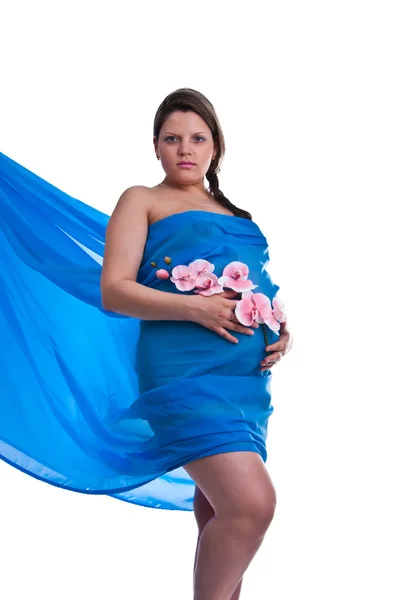 Zwanger jong vrouw in stof met orchidee — Stockfoto