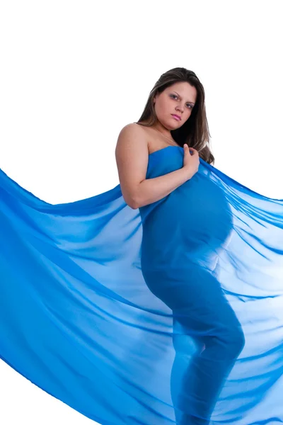 Kumaş giymiş hamile genç bir kadın. — Stok fotoğraf