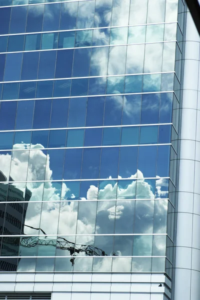 stock image Reflection in a modern building's glass panels