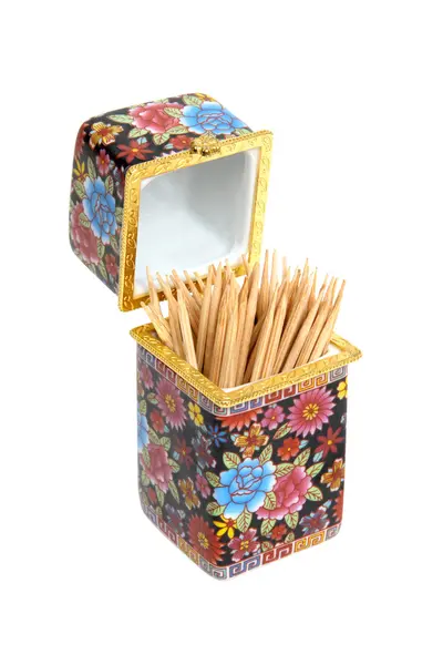 Decorated porcelain toothpick holder and bamboo toothpicks — Stock Photo, Image