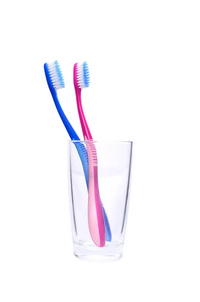 Två tandborstar i glas — Stockfoto