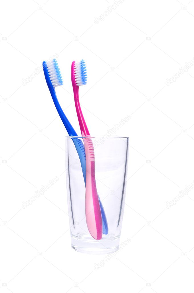 Two toothbrushes in the glass