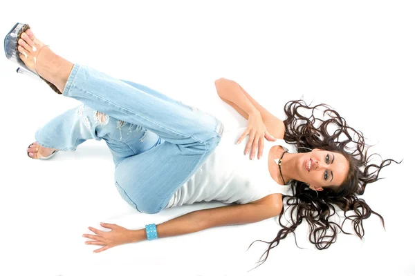 The girl laying on white with scattered hair — Stock Photo, Image