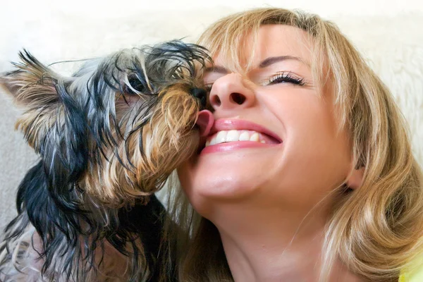 stock image Women plays with a puppy of a terrier