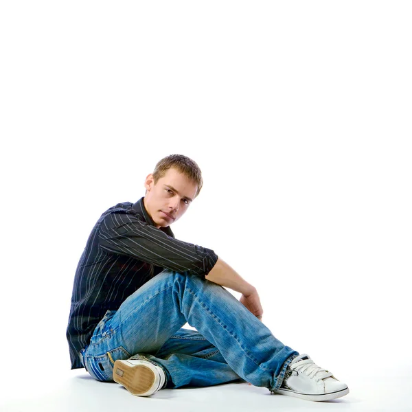 The young man posing in studio — Stock Photo, Image