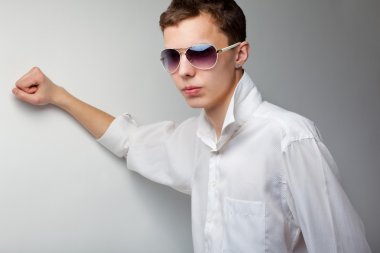 Young handsome man in sunglasses clipart