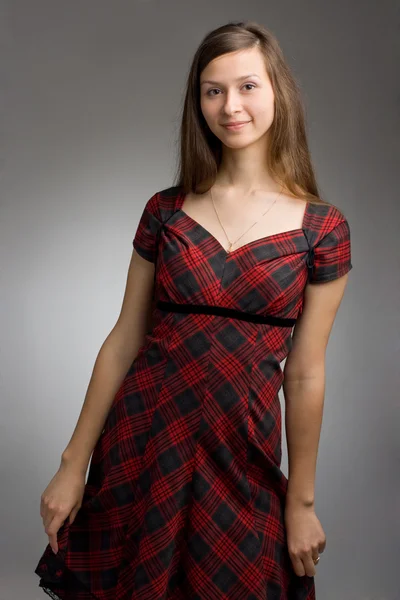 Young beautiful woman in dress — Stock Photo, Image