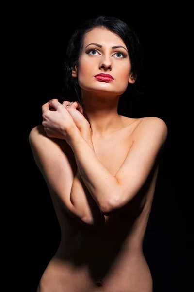 Mujer joven con las manos sobre el torso —  Fotos de Stock